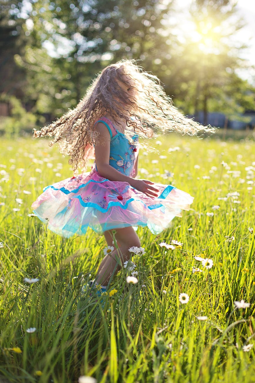 carefree cheerful child daisies