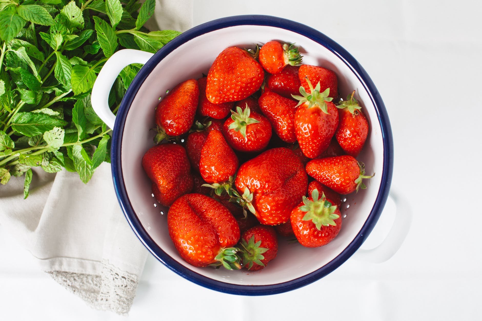 strawberries in white bowl