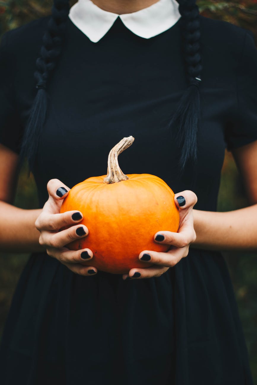 girl holding pumpkin
