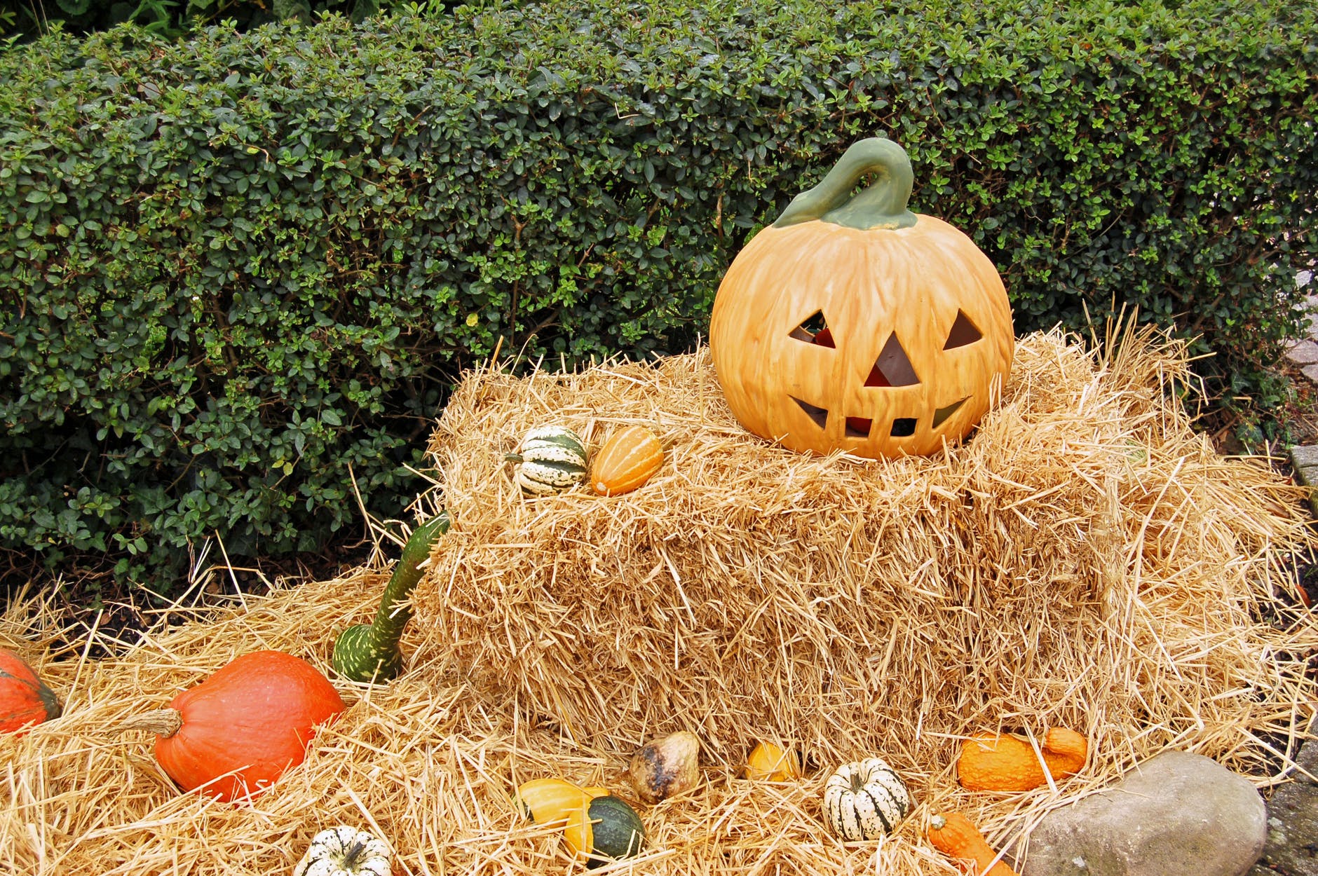 jack o lantern on hay stack during day