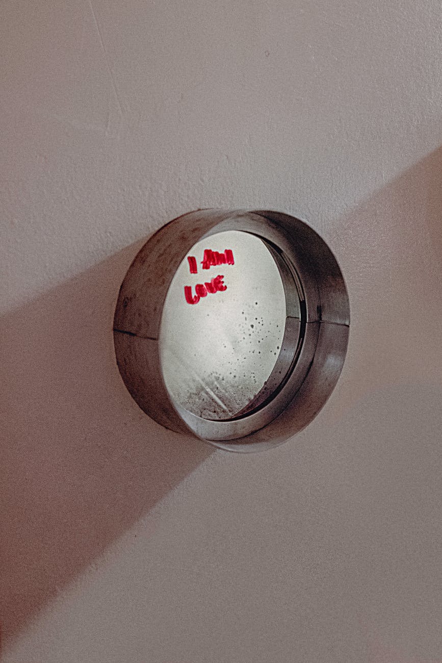 round gray framed mirror