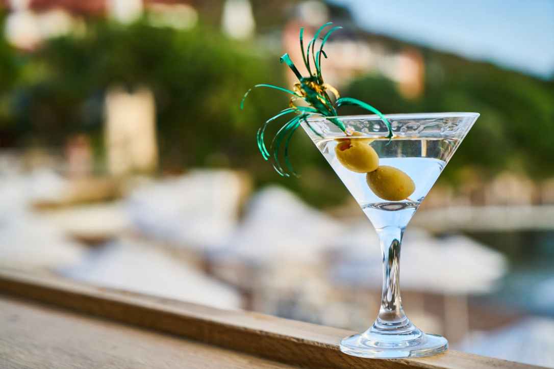close up photo of martini with olives
